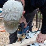 Sam cuts a bird's mouth in the roof rafter.