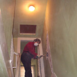 I think this happened a few days after we signed the papers. We had planned to remove the wall between the two units, so Sue grabbed a hammer and got things going.