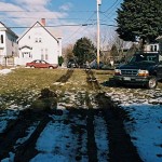 Removal proved to be a challenge, as the yard was wet from spring snow and rain. It took several hours and eventually a very big tow truck to get the dumpster off the lawn. It took a few more years to fill in the ruts.