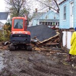 Porch gone, now he turns his attention to the garage. It didn't take much.