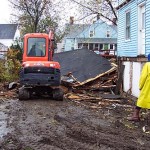Porch gone, now he turns his attention to the garage. It didn't take much.