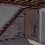 Another view of the living room ceiling. You can see where we removed the staircase to the upstairs in the right-hand unit.