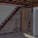 Another view of the living room ceiling. You can see where we removed the staircase to the upstairs in the right-hand unit.