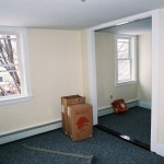 Carpet in the bedroom, light fixtures waiting to be installed.