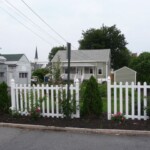 Picket fence with roses at the front of the property.