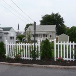 Picket fence with roses at the front of the property.