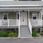 Since I couldn't find a manufactured sidelight that fit the space we had available, I built one, which you can see partially obscured by a porch post.